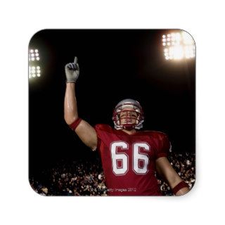 Football player holding up index finger stickers