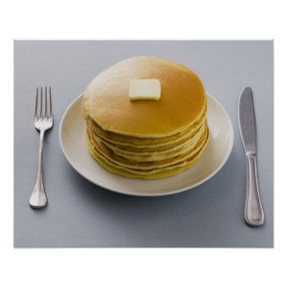 Stack of pancakes with butter on a plate poster