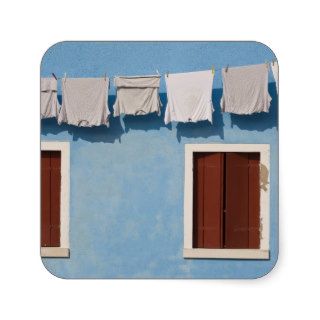 Italy, Burano. Hanging laundry and windows along Stickers