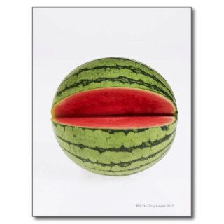 Organic watermelon with a slice cut into it, on postcards
