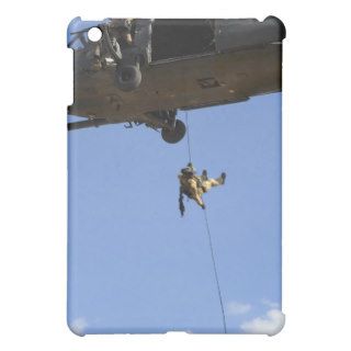 A pararescueman rappels an HH 60 iPad Mini Covers