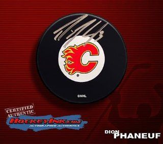 Dion Phaneuf Autographed Calgary Flames Hockey Puck   Autographed NHL Pucks Sports Collectibles