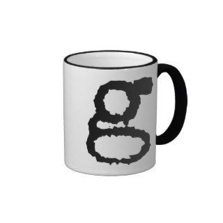lowercase letter g in black mug