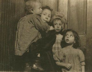 1910 child labor photo 330 P.M. Group in tenement hallway. Ages, 14 months, b7  