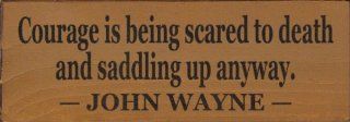 Courage is being scared to death and saddling up anyway. ~ John Wayne Wooden Sign   Decorative Signs