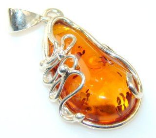 Amber Women Silver Pendant 5.90g (color brown, dim. 1 3/4, 5/8, 3/8 inch). Amber Crafted in 925 Sterling Silver only ONE pendant available   pendant entirely handmade by the most gifted artisans   one of a kind world wide item   FREE GIFT BOX Pendant Ne
