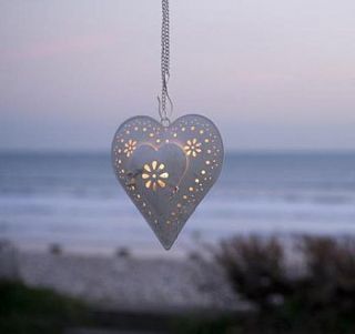 hanging heart tea light lantern by the contemporary home