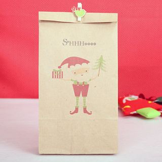 secret santa gift bag with name by red berry apple