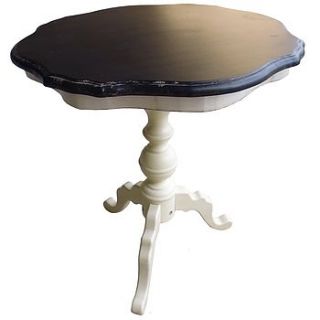 black and cream round wooden table by marquis & dawe