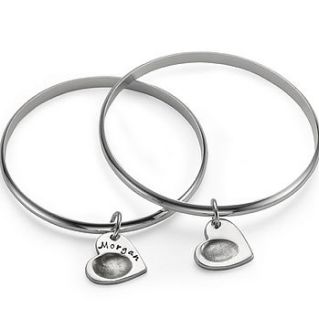 silver bangle with fingerprint charm by button and bean