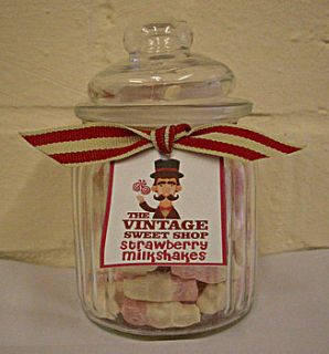 glass jar with strawberry milkshakes by ocean blue candy