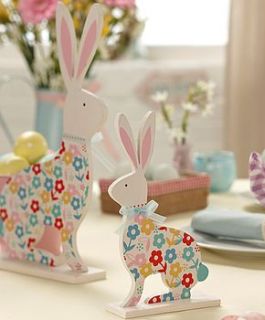 set of two bright floral easter bunnies by the contemporary home