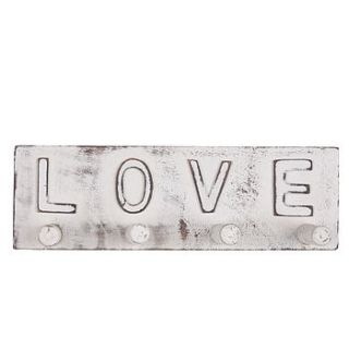 'love' peg rail by the contemporary home