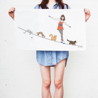 girl and cats on tightrope tea towel by sophie parker