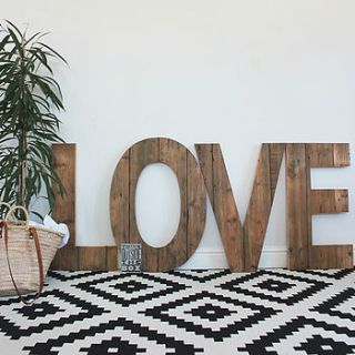 giant handmade reclaimed wooden 'love' sign by ruby rhino