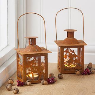 rusted tin lantern by the contemporary home