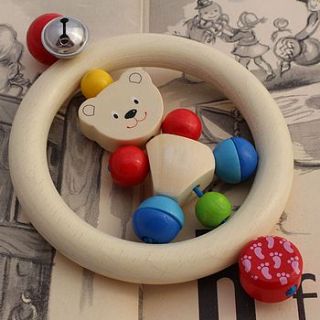 wooden baby rattle with friendly bear by nest