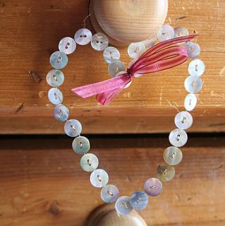 handmade mother of pearl button heart by weddings by primitive angel