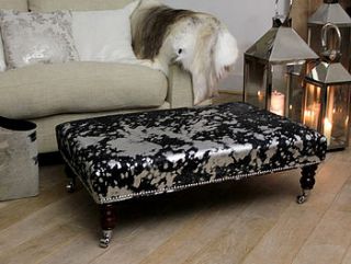 grey and black cowhide footstool by london cows