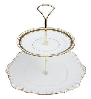 white and gold vintage cake stand by the vintage tea cup