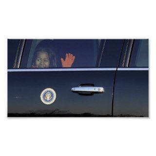 Sasha Obama waves through the limousine window Poster