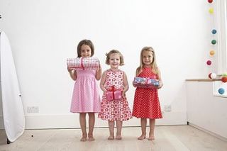 pink dotty party dress with ties by toby tiger