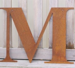 rusty metal letters, words or names by the estate yard