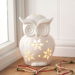 white ceramic owl tea light holder by the contemporary home