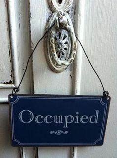 'occupied/vacant' metal sign by the hiding place