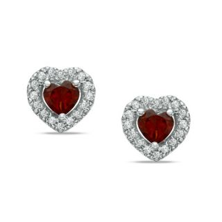 Heart Shaped Garnet and 1/7 CT. T.W. Diamond Frame Stud Earrings in