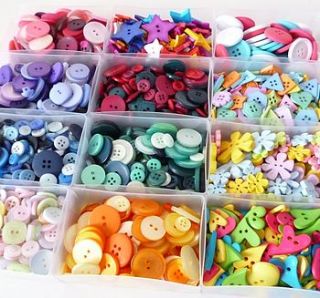 box of buttons by paper and string