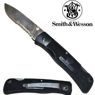 SW 510. 8" Smith & Wesson Folding Knife  Black w/ Silver Blade 8" Smith & Wesson Folding Knife  Black w/ Silver Blade. The knife measures 8" overall with3.5" long silver blade with half serration, "Smith &Wesson" 
