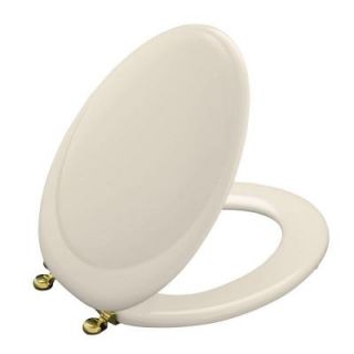 KOHLER Revival Elongated Closed front Toilet Seat with New England Brass Hinge in Almond DISCONTINUED K 4615 BR 47
